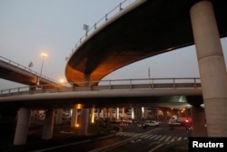 FILE - The Henri Konan Bedie toll bridge, which was named after a former Ivory Coast president, is seen in Abidjan, Dec. 15, 2014.