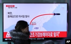A television screen showing a news program reporting about North Korea's missile firing, at Seoul Train Station in Seoul, South Korea, Monday, March 6, 2017.