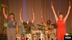 The six members of Vocal Trash spread their reuse and recycle message with every performance. (VOA/S. Logue)