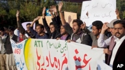 FILE - Pakistani students shout slogans against the Islamic State group in Islamabad, Nov 20, 2014.