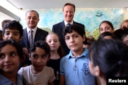 Prime Minister David Cameron visits the Sed El Boucrieh School with Lebanese Education minister, Mr Elias Bou Saab, in Beirut, Lebanon, Sept. 14, 2015.