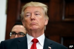 President Donald Trump in the Roosevelt Room of the White House, Oct. 12, 2017, in Washington.