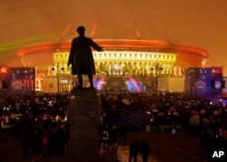 People watch a light show at the new soccer stadium on Krestovsky Island, which will host some 2018 World Cup and 2017 Confederations Cup matches, in St. Petersburg, Russia, April 22, 2017.