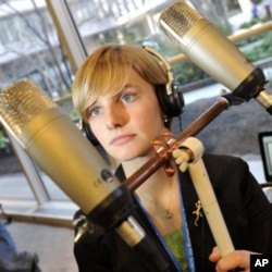 Finalist Marian Bechtel, from Lancaster, Pennsylvania, demonstrates her prototype landmine detector for judges and the public.