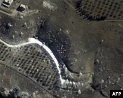 FILE - A video grab made on September 30, 2015, shows an image taken footage made available on the Russian Defense Ministry's official website, purporting to show an airstrike in Syria.