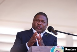 FILE - Mozambique's President Filipe Nyusi speaks during Armed Forces Day celebrations in Pemba, Mozambique, Sept. 25, 2021.