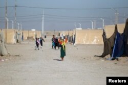Displaced Iraqi people are seen at the Amriyat al Fallujah camp in Anbar Province, Iraq Jan. 3, 2018.