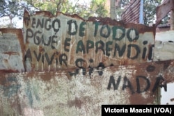 "I have everything, because I've learned to live without anything," reads a sign near Calabazar, on the outskirts of Havana, Cuba.