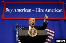 FILE - U.S. President Donald Trump speaks before signing an executive order directing federal agencies to recommend changes to a temporary visa program used to bring foreign workers to the United States to fill high-skilled jobs during a visit to the world headquarters of Snap-On Inc, a tool manufacturer, in Kenosha, Wisconsin, April 18, 2017.