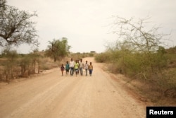 Students walk home from school in the outskirts of Badme, territorial dispute town between Eritrea and Ethiopia currently occupied by Ethiopia, June 8, 2018.