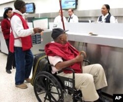 Passenger traveling to Haiti on American Airlines first commercial flight to Port-au-Prince after earthquake, 19 Feb 2010