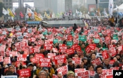 South Korean protesters stage a rally calling for South Korean President Park Geun-hye to step down in downtown Seoul, South Korea, Saturday, Nov. 5, 2016.