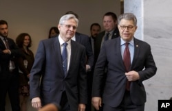 Judge Merrick Garland (L), President Barack Obama’s choice to replace the late Justice Antonin Scalia on the Supreme Court, meets with Senate Judiciary Committee member, Democratic Senator Al Franken, on Capitol Hill in Washington, March 30, 2016.