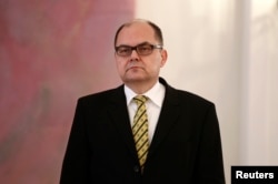 FILE - German Agriculture Minister Christian Schmidt looks on during the cermony of appointment at Bellevue Castle in Berlin.
