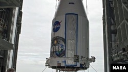 Enclosed in its payload fairing, NASA's Tracking and Data Relay Satellite, TDRS-K, is lifted for placement atop a United Launch Alliance Atlas V rocket at Cape Canaveral Air Force Station's Space Launch Complex 41, 20 Jan 2013. (NASA)