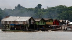 Dredging barges operated by illegal miners converge on the Madeira river, a tributary of the Amazon, searching for gold, in Autazes, Amazonas state, Brazil, Nov. 25, 2021.