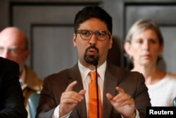 FILE - Freddy Guevara, first vice president of the National Assembly makes declarations to the media at the National Assembly in Caracas, Aug. 19, 2017.
