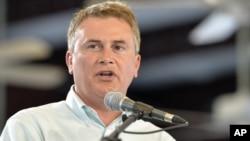 FILE - Rep. James Comer, then the Kentucky Agriculture Commissioner, talks with the crowd at Fancy Farm, Ky., Aug. 1, 2015.