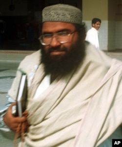 FILE - Maulana Masood Azhar, Muslim cleric and leader of the militant group fighting in Indian-held Kashmir against Indian forces arrives at Karachi airport, Jan. 22, 2000.