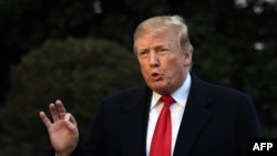 FILE - U.S. President Donald Trump speaks to reporters upon his return to the White House in Washington, D.C., March 24, 2019.