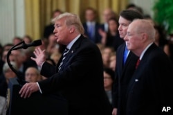 President Donald Trump, from left, with Justice Brett Kavanaugh and retired Justice Anthony Kennedy, speaks during the ceremonial swearing-in ceremony of Kavanaugh as Associate Justice of the Supreme Court of the United States in the East Room of the White House in Washington, Oct. 8, 2018.