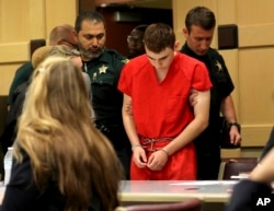 Nikolas Cruz appears in court for a status hearing before Broward Circuit Judge Elizabeth Scherer, Feb. 19, 2018, in Fort Lauderdale, Fla.