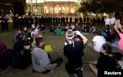 Protesters are surrounded by Los Angeles police before they were detained in Grand Park across Los Angeles City Hall after a march and rally against the election of Republican Donald Trump as president of the United States, Nov. 12, 2016.