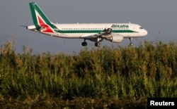 FILE - An Alitalia airplane approaches to land at Fiumicino airport in Rome, Italy, Oct. 24, 2018.