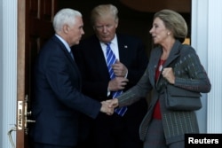 U.S. President-elect Donald Trump and Vice President-elect Mike Pence emerge with Betsy DeVos after their meeting at the main clubhouse at Trump National Golf Club in Bedminster, N.J. Nov. 19, 2016.