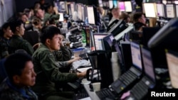 FILE - Members from U.S. and South Korean militaries man the Hardened Theater Air Control Center during the first day of Ulchi Freedom Guardian at Osan Air Base, South Korea, Aug. 17, 2015