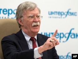 U.S. National security adviser John Bolton gestures while speaking to the media after his talks with Russian President Vladimir Putin in Moscow, Russia, June 27, 2018.