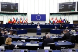 European Commission President Ursula von der Leyen delivers a speech during a plenary session at the European Parliament in Strasbourg, eastern France, Dec. 15, 2021.