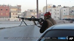 FILE - This photo posted on a file sharing website Wednesday, Jan. 11, 2017, by the so-called Islamic State Group in Sinai, a militant organization, shows a deadly attack by militants on an Egyptian police checkpoint, Monday, Jan. 9, 2017, in el-Arish, north Sinai, Egypt.