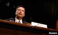 FILE - Former FBI Director James Comey testifies on Capitol Hill in Washington, June 8, 2017.