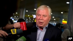 Lawyer Anatoly Kucherena speaks to reporters at Sheremetyevo airport outside Moscow, July 12. 2013.