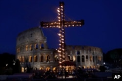 A view of the ancient Colosseum in Rome, April 14, 2017. Pope Francis presided over the Via Crucis (Way of the Cross) torchlight procession on Good Friday in front of Rome's Colosseum.