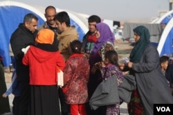 Families continue to flee IS-controlled areas in and around Mosul. This group is shown at a camp in Khazir, Kurdish Iraq, Jan. 10, 2017. The International Organization for Migration says 140,000 people have been displaced since the offensive to re-take Mosul from IS militants began in October. (H. Murdock/VOA)