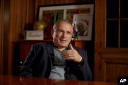 FILE - Russian opposition figure Mikhail Khodorkovsky, the former owner of the Yukos Oil Company, speaks during an interview by The Associated Press in London, Tuesday, July 24, 2018.