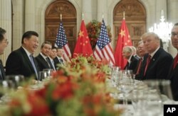 FILE - President Donald Trump meets with China's President Xi Jinping during their bilateral meeting at the G-20 summit in Buenos Aires, Argentina, Dec. 1, 2018.