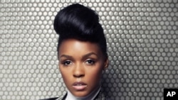 FILE - In this Aug. 12, 2013 file photo, American R&B and soul musician, composer and record producer, Janelle Monae poses for a portrait at Dream Downtown, in New York.