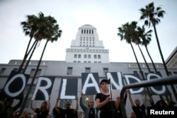 Singer Lady Gaga speaks at a vigil in memory of victims one day after a mass shooting at the Pulse gay nightclub in Orlando, outside City Hall in Los Angeles, California, June 13, 2016.