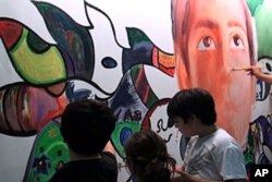 Children working on climate change painting