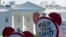 FILE- Protesters gather outside the White House in Washington to protest President Donald Trump's decision to withdraw the Unites States from the Paris climate change accord, June 1, 2017. 