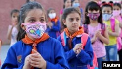 A guest arrives wearing a face mask during the 46th US film festival of Deauville, northwestern France, on Sept. 12, 2020. 
