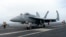 A F-18E parks on the flight deck of a USS Theodore Roosevelt aircraft carrier on Thursday, April 11, 2024 during a three-day joint naval exercise by the U.S., Japanese and South Korea at the East China Sea.
