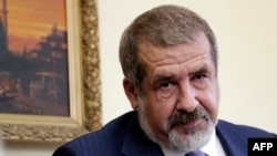 FILE - The leader of the Crimean Tatars' assembly, known as the Mejlis, Refat Chubarov, attends a press conference in the Crimean capital, Simferopol, on May 16 2014.
