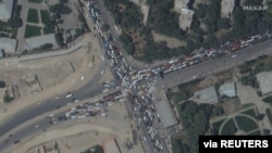 Traffic jam and crowds are seen near Kabul's airport in Afghanistan, Aug. 16, 2021.
