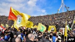 Mourners attend the funeral of slain Hezbollah leaders Hassan Nasrallah and Hashem Safieddine at the Camille Chamoun Sports City Stadium on the outskirts of Beirut on February 23, 2025.