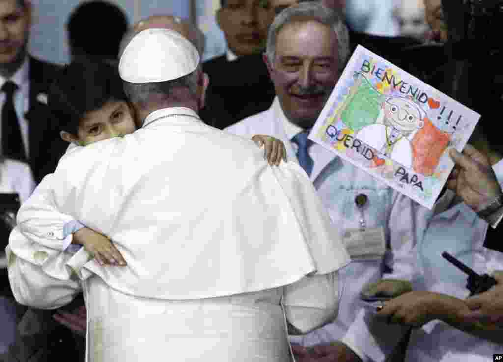 Five-year-old Rodrigo Lopez Miranda embraces Pope Francis, during his visit to the Federico Gomez Pediatric Hospital, in Mexico City, Feb. 14, 2016.