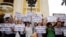 FILE - Vietnamese protesters hold banners reading "Get out Formosa" and "I love the sea, shrimp and fish" during a rally denouncing recent mass fish deaths in Vietnam's central province, in Hanoi, Vietnam, May 1, 2016.